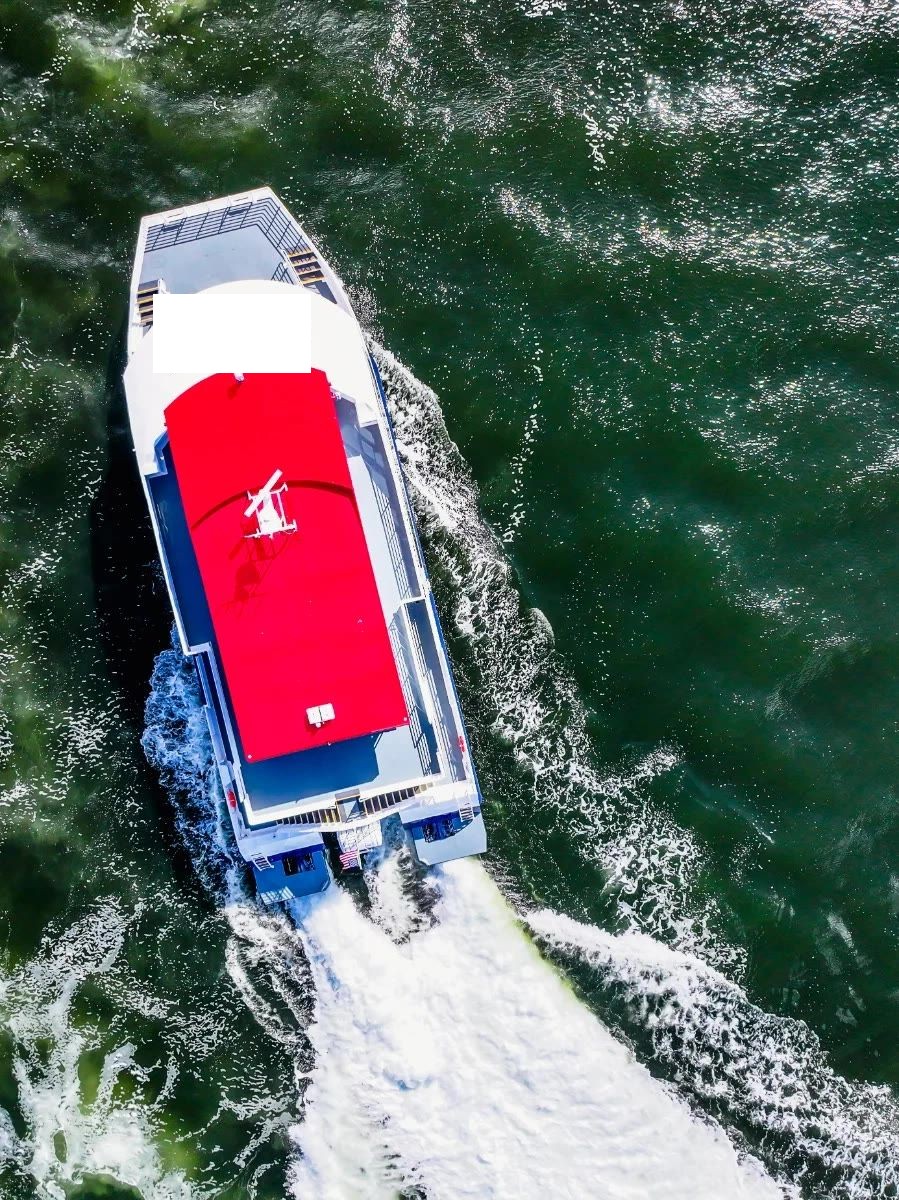 Aluminum catamaran passenger boat departing port